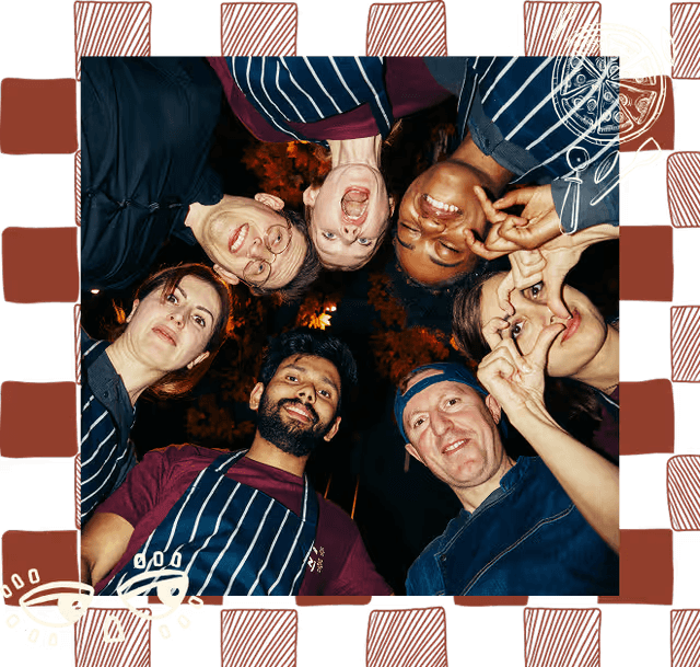 Zizzi staff looking down at camera smiling