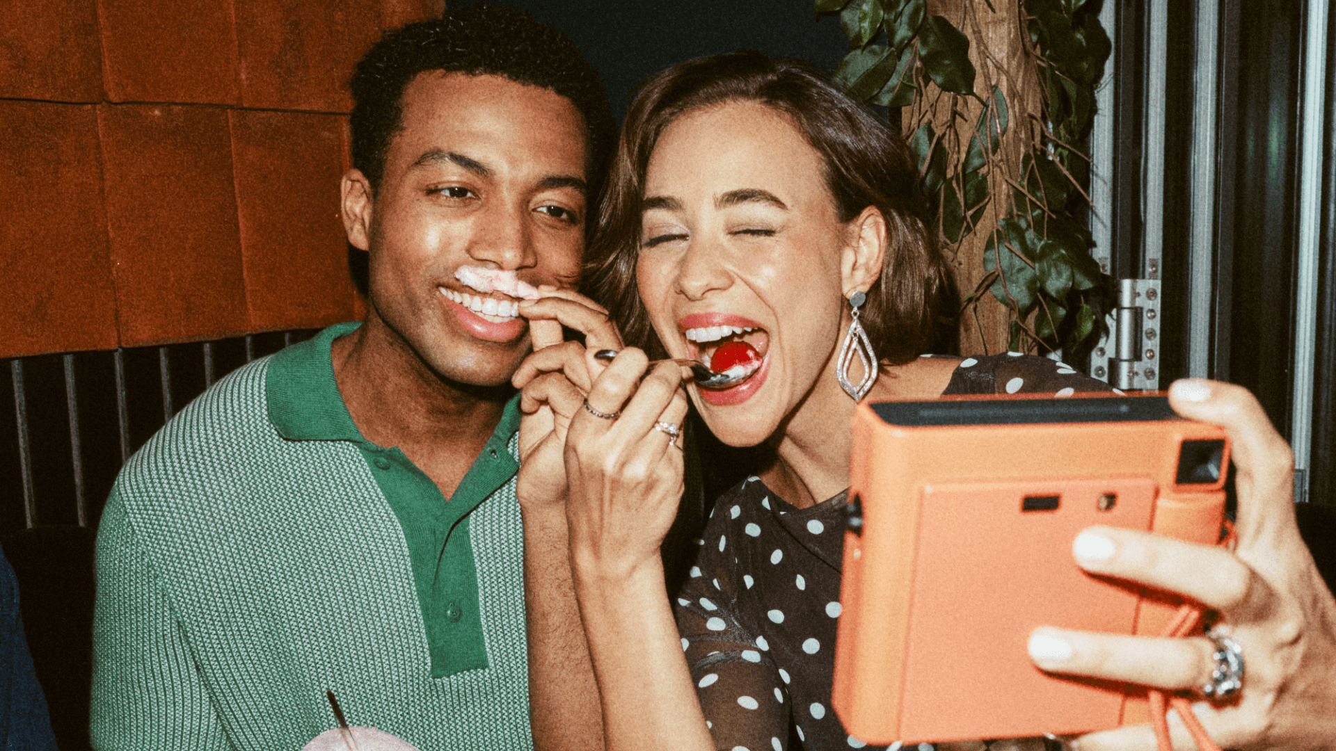 Friends taking a selfie together in a restaurant